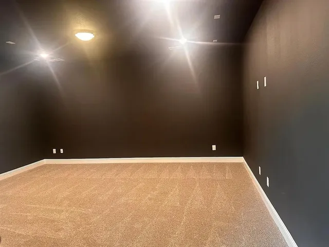 a view of a hallway and wooden floor