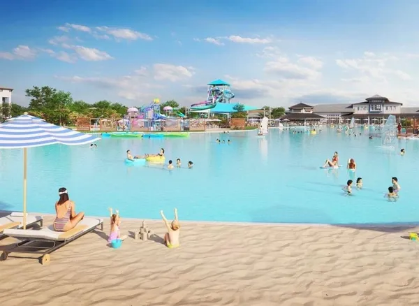 a front view of a house with a garden and outdoor seating