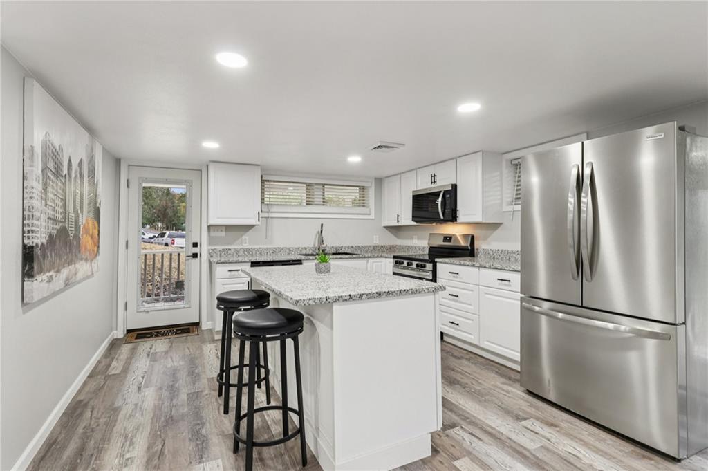 305 Queenstown Road Karns City, PA 16041 - Photo 15 of 38 a kitchen with stainless steel appliances granite countertop a refrigerator stove microwave and sink