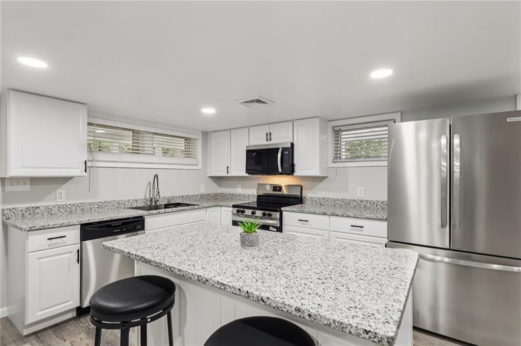 305 Queenstown Road Karns City, PA 16041 - Photo 17 of 38 a kitchen with refrigerator and chairs
