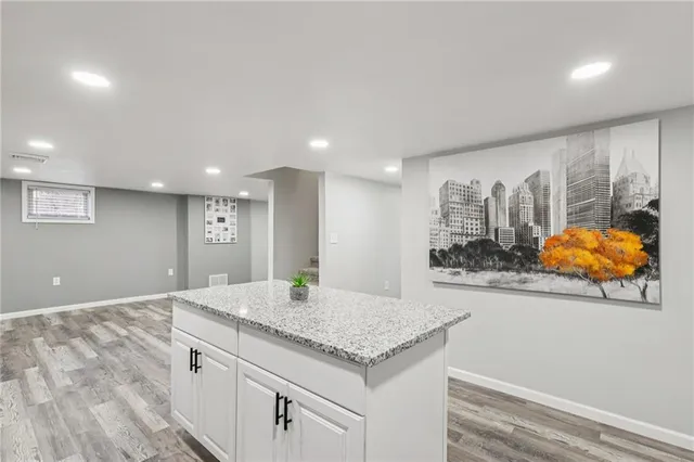 a view of kitchen and wooden floor