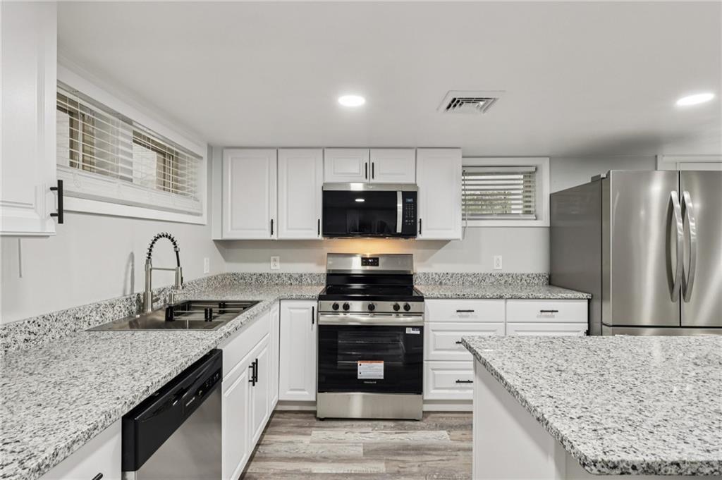 305 Queenstown Road Karns City, PA 16041 - Photo 20 of 38 a kitchen with granite countertop a stove sink and refrigerator