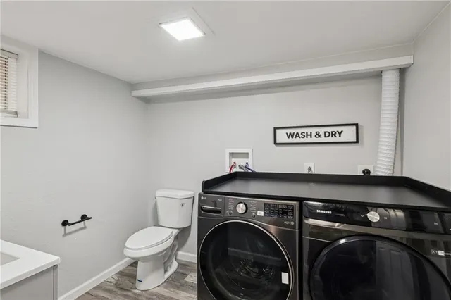 a view of a storage & utility room with a washer and dryer