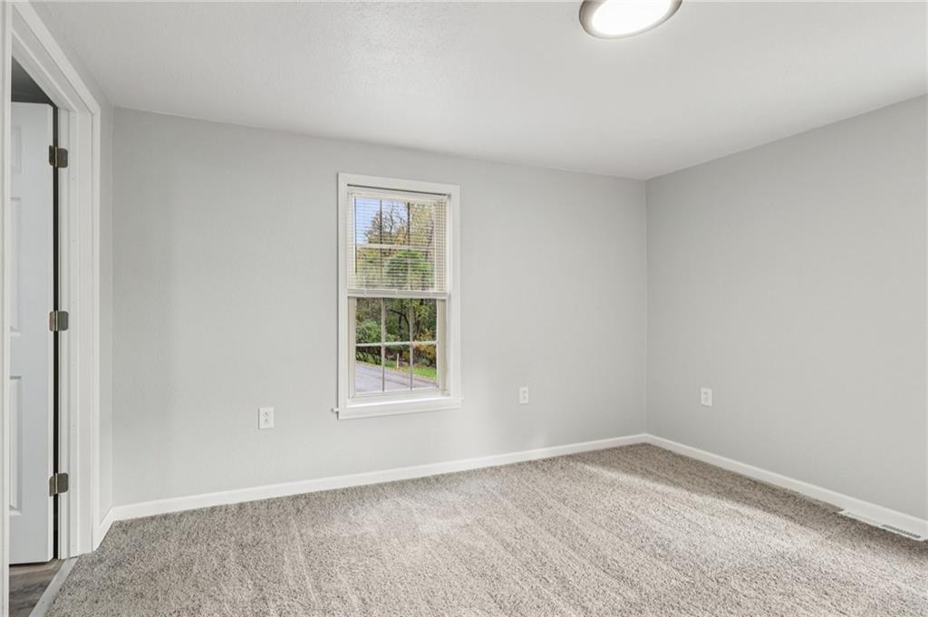 305 Queenstown Road Karns City, PA 16041 - Photo 32 of 38 an empty room with a window