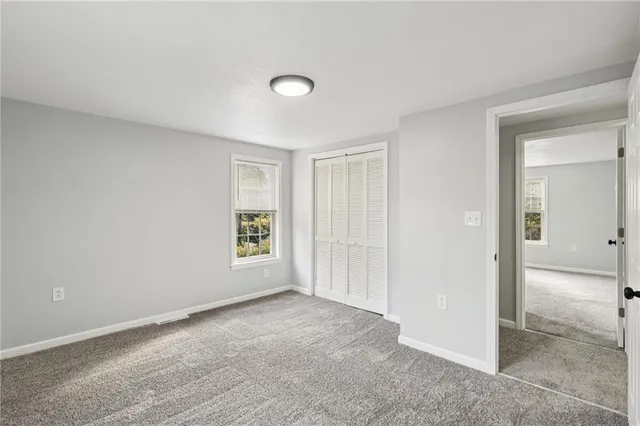 a view of an empty room and window