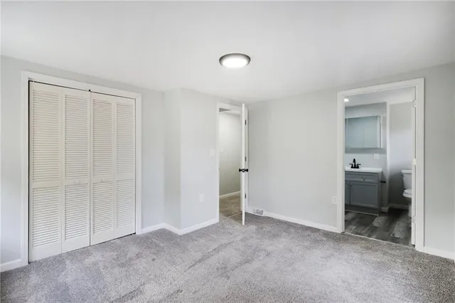 an empty room with a bathroom