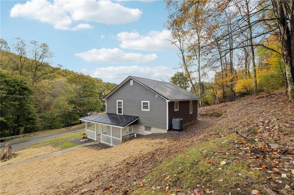 305 Queenstown Road Karns City, PA 16041 - Photo 36 of 38 a house that has a tree in front of it