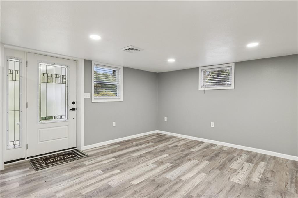305 Queenstown Road Karns City, PA 16041 - Photo 10 of 38 a view of a livingroom with wooden floor and window