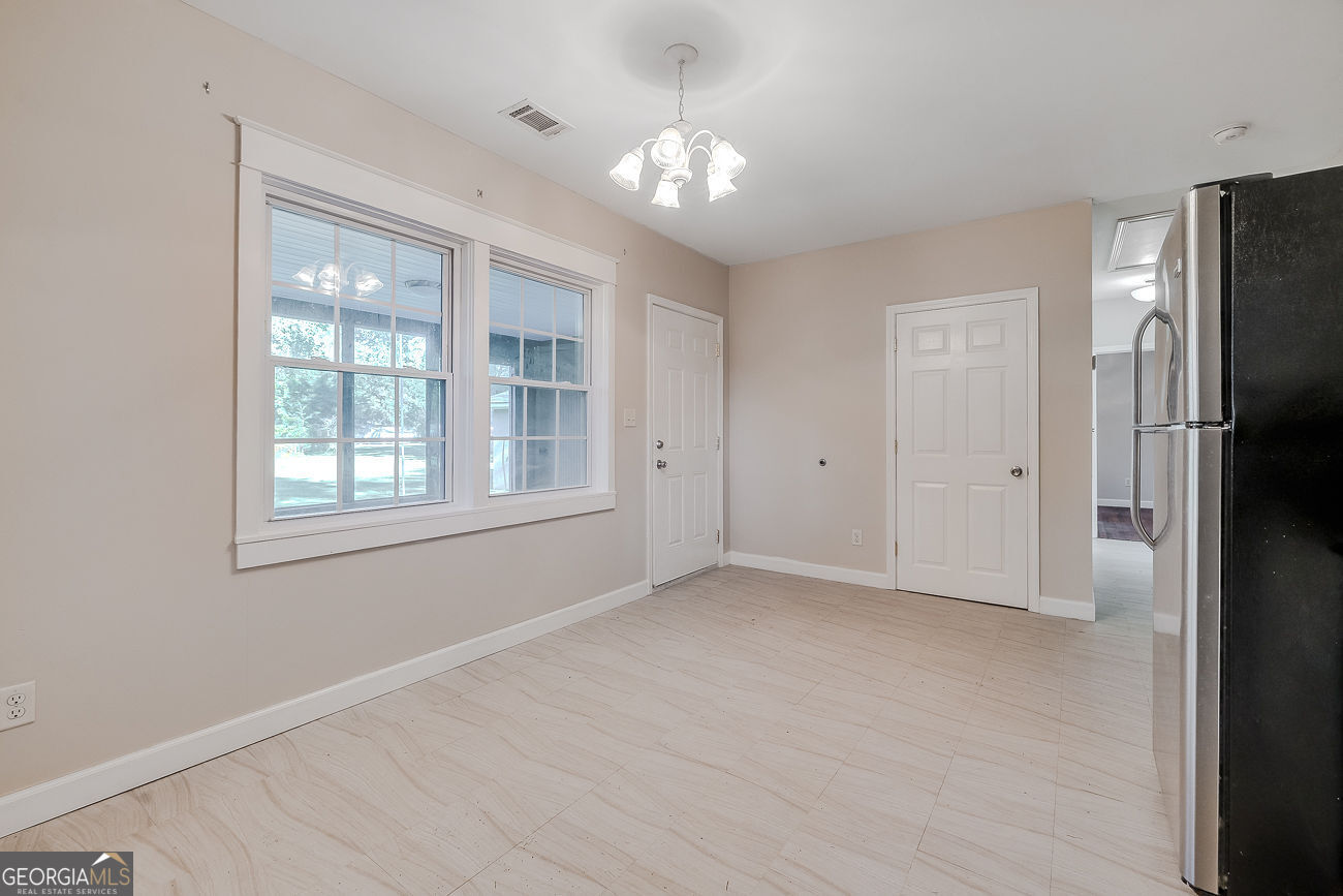 125 Parsons Avenue Pooler, GA 31322 - Photo 13 of 28 a view of an empty room with a window