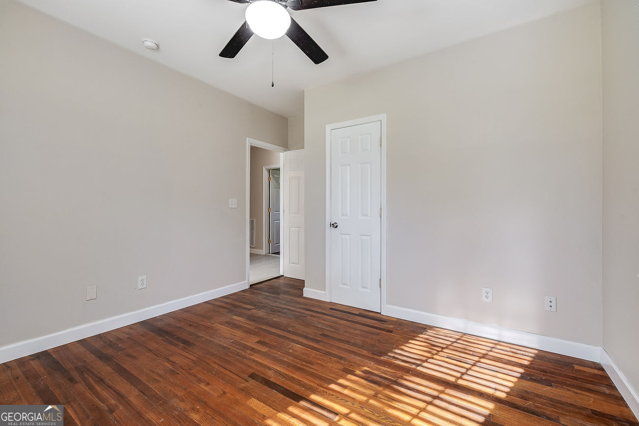 125 Parsons Avenue Pooler, GA 31322 - Photo 17 of 28 a view of a room with wooden floor and chandelier fan