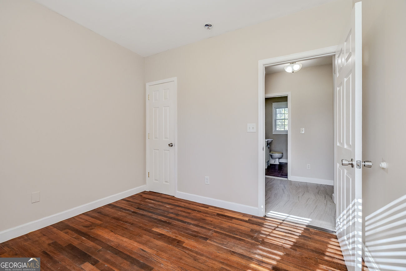 125 Parsons Avenue Pooler, GA 31322 - Photo 21 of 28 a view of an empty room with wooden floor and closet