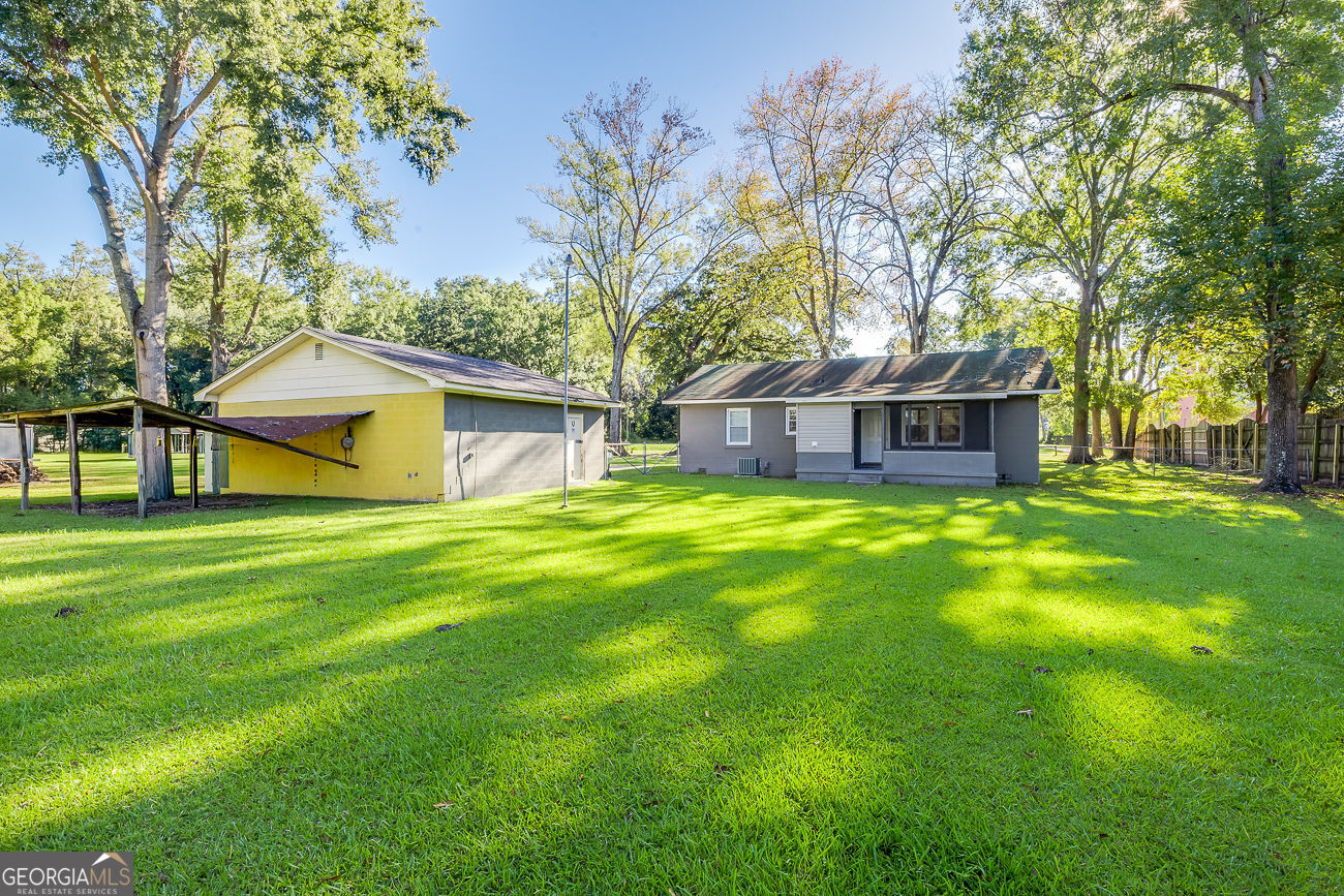 125 Parsons Avenue Pooler, GA 31322 - Photo 27 of 28 a view of a house with a big yard and large tree