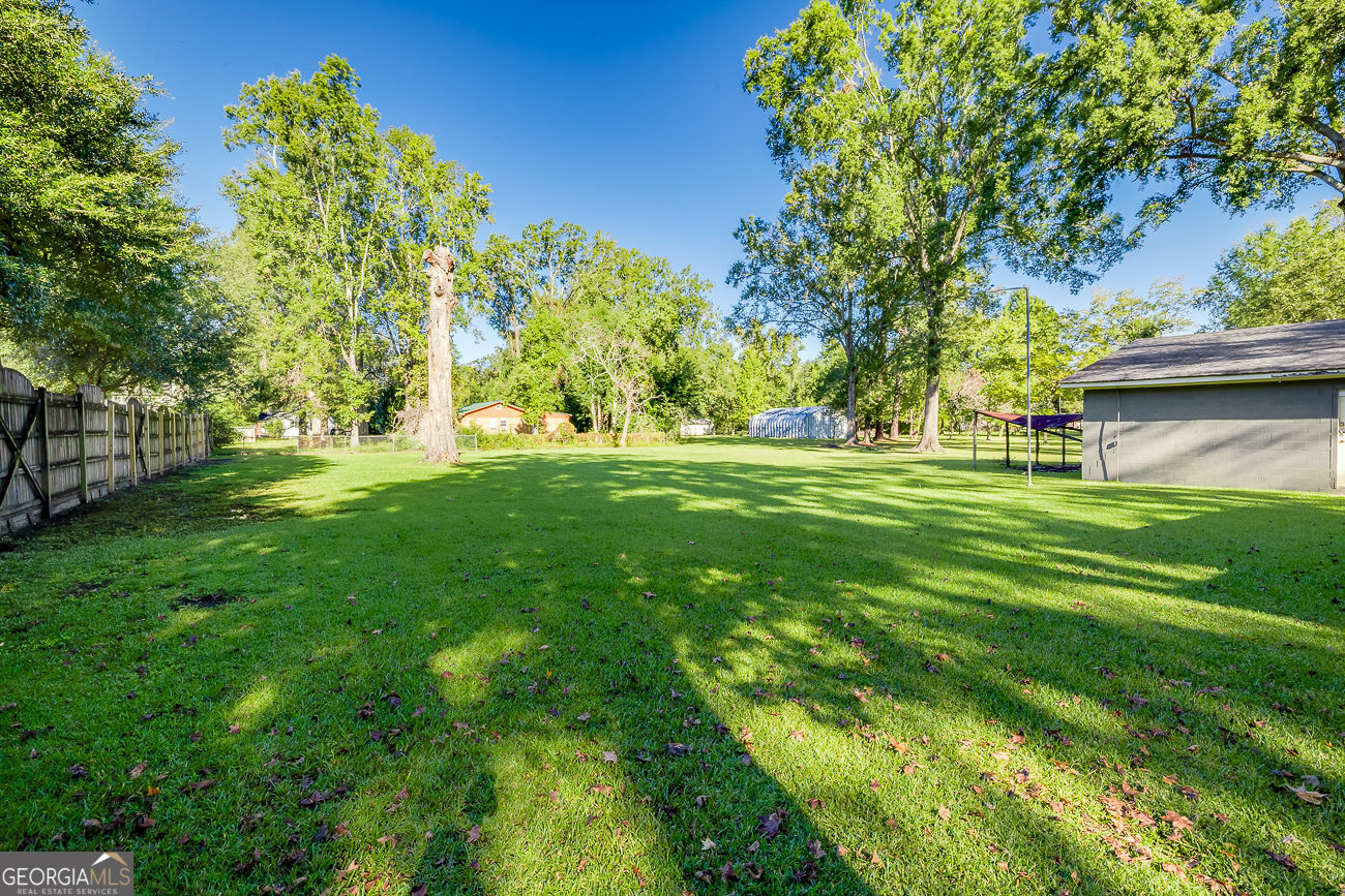 125 Parsons Avenue Pooler, GA 31322 - Photo 28 of 28 a view of a grassy field with trees