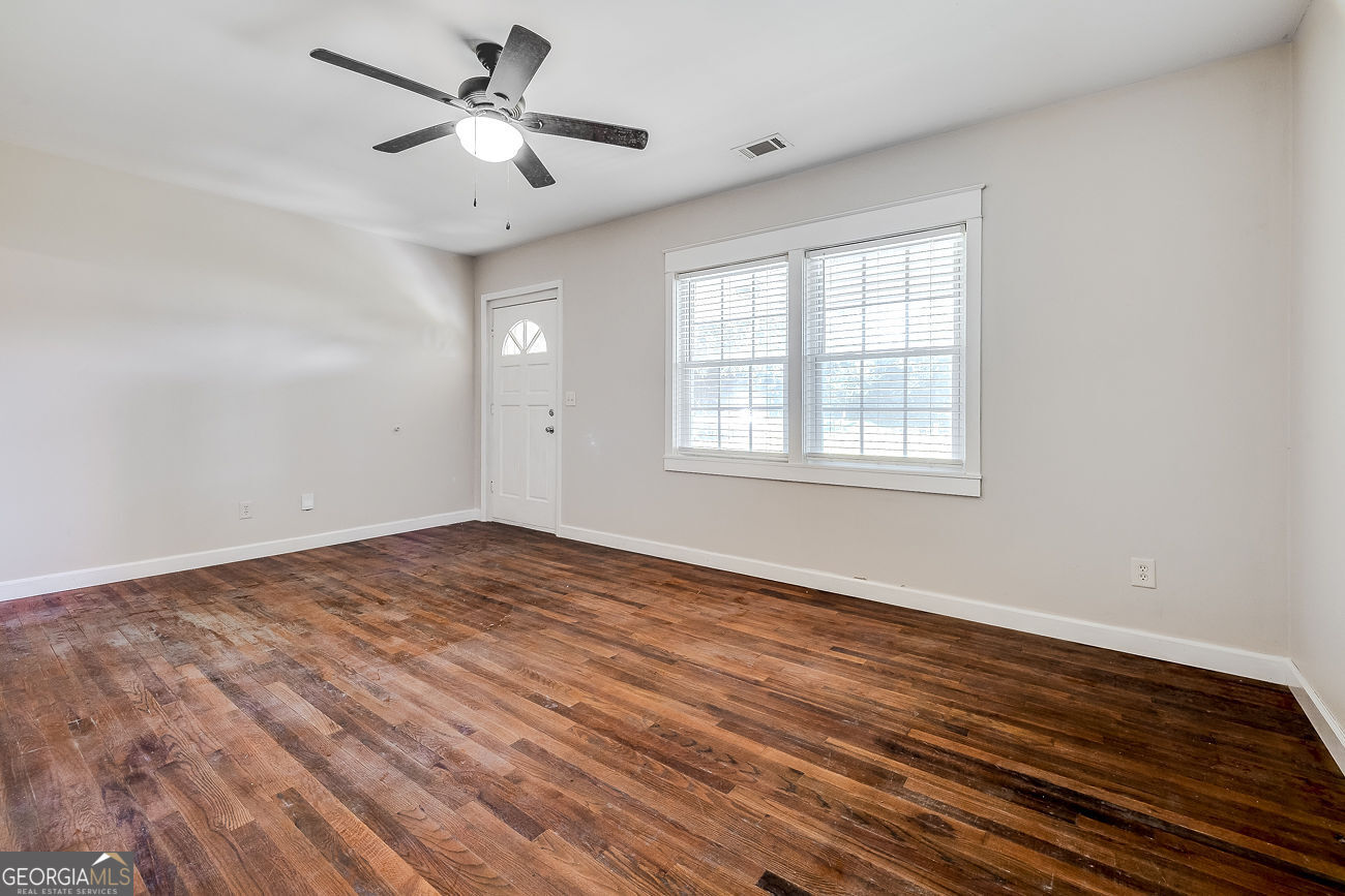 125 Parsons Avenue Pooler, GA 31322 - Photo 7 of 28 wooden floor in an empty room with a window