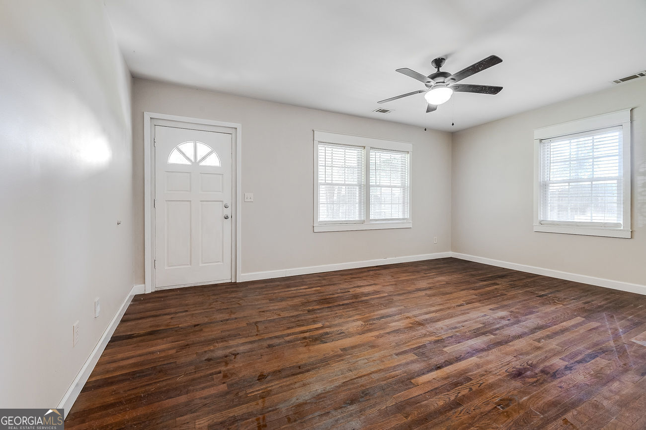 125 Parsons Avenue Pooler, GA 31322 - Photo 8 of 28 a view of an empty room with wooden floor and a window