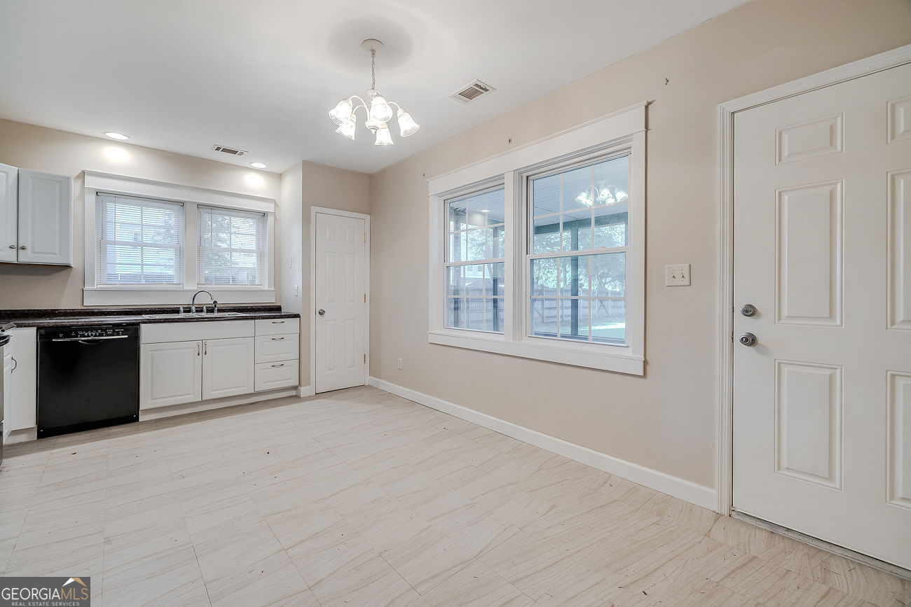 125 Parsons Avenue Pooler, GA 31322 - Photo 9 of 28 a large kitchen with cabinets and stainless steel appliances