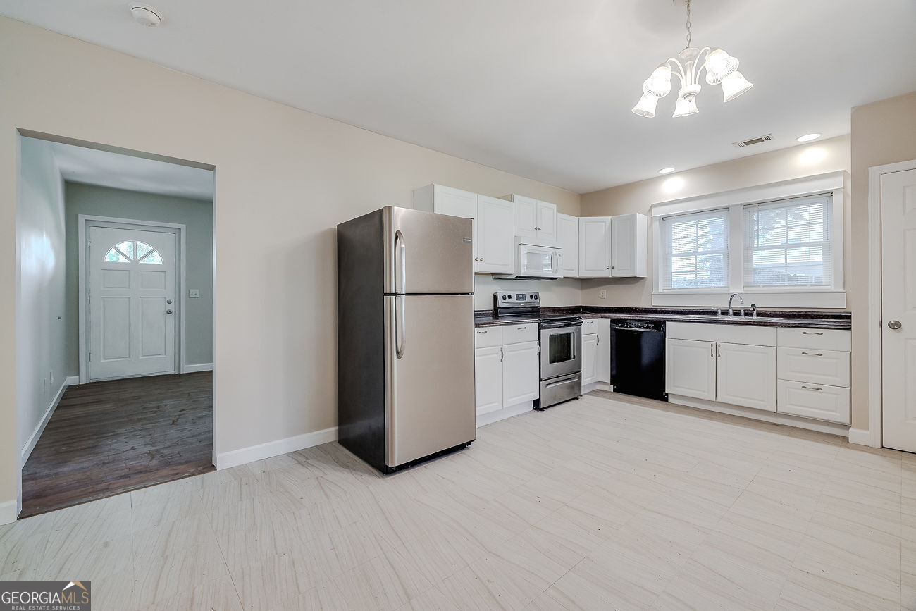 125 Parsons Avenue Pooler, GA 31322 - Photo 10 of 28 a kitchen with a refrigerator and a sink