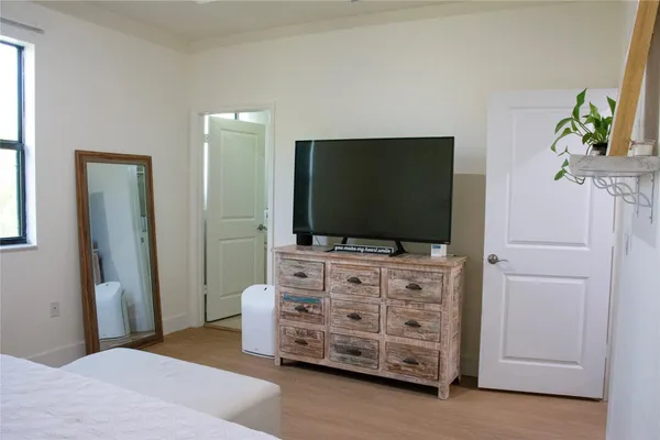 a bathroom with a shower and a sink