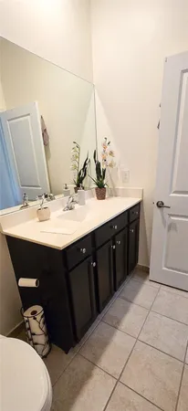 a bathroom with a sink a toilet and bathtub