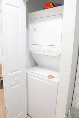 a view of a park with plants and a bench