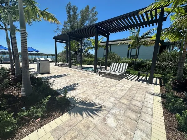 a patio with a patio table and chairs