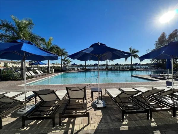 a view of a swimming pool with a patio