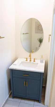 a view of wooden floor in a white room