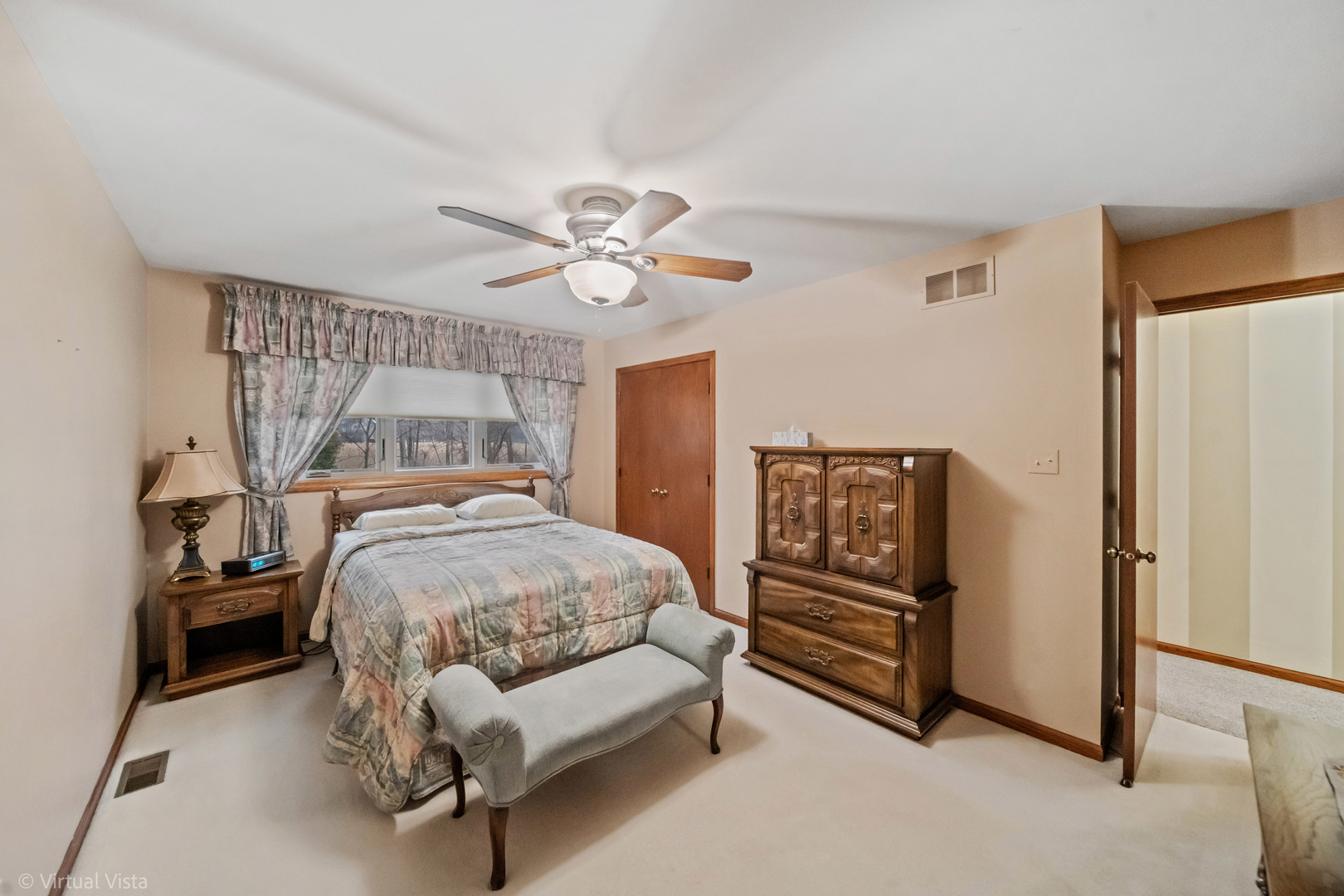 1262 Rutgers Drive Woodridge, IL 60517 - Photo 12 of 22 a bedroom with a bed and a chandelier