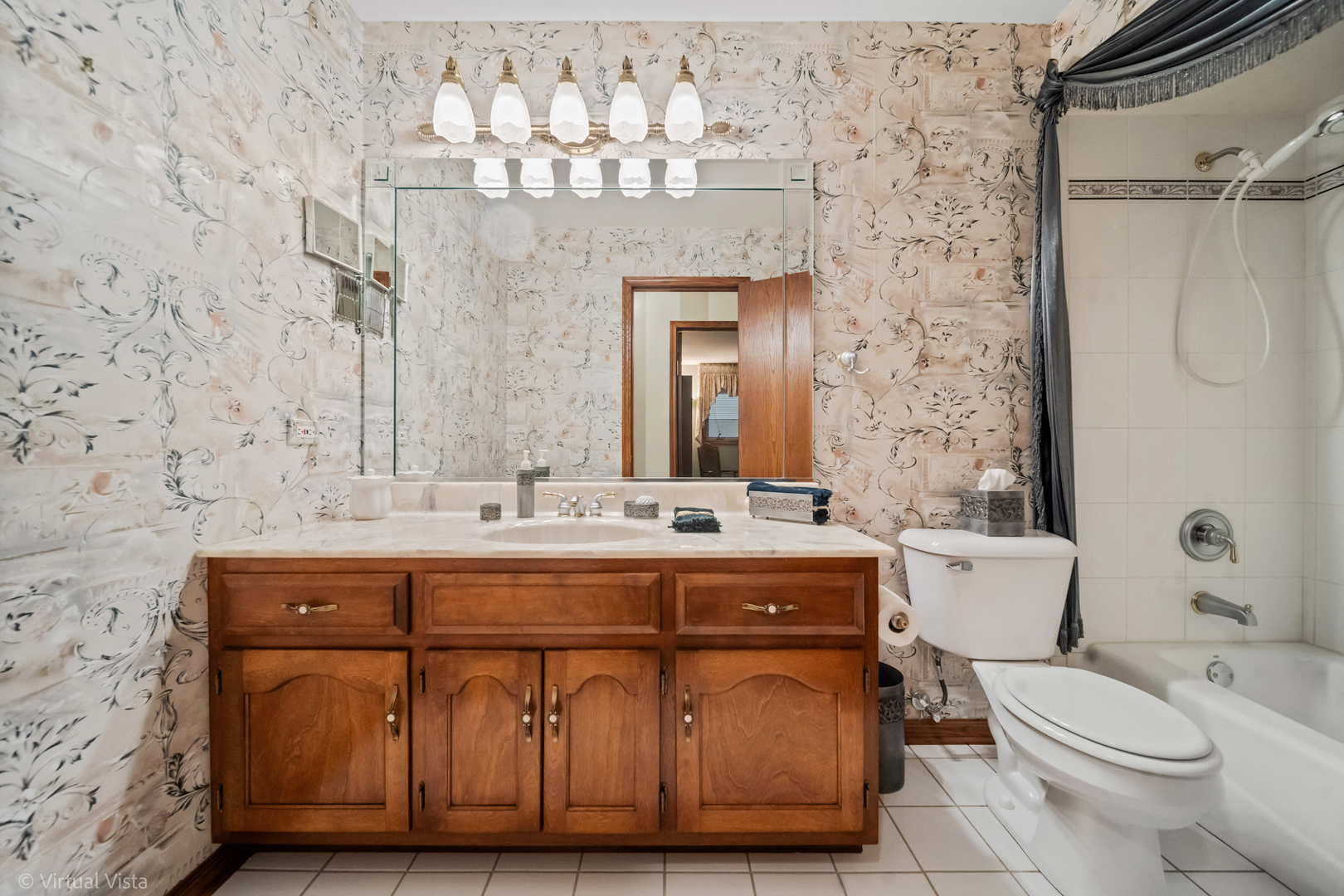 1262 Rutgers Drive Woodridge, IL 60517 - Photo 15 of 22 a bathroom with a sink mirror vanity and toilet