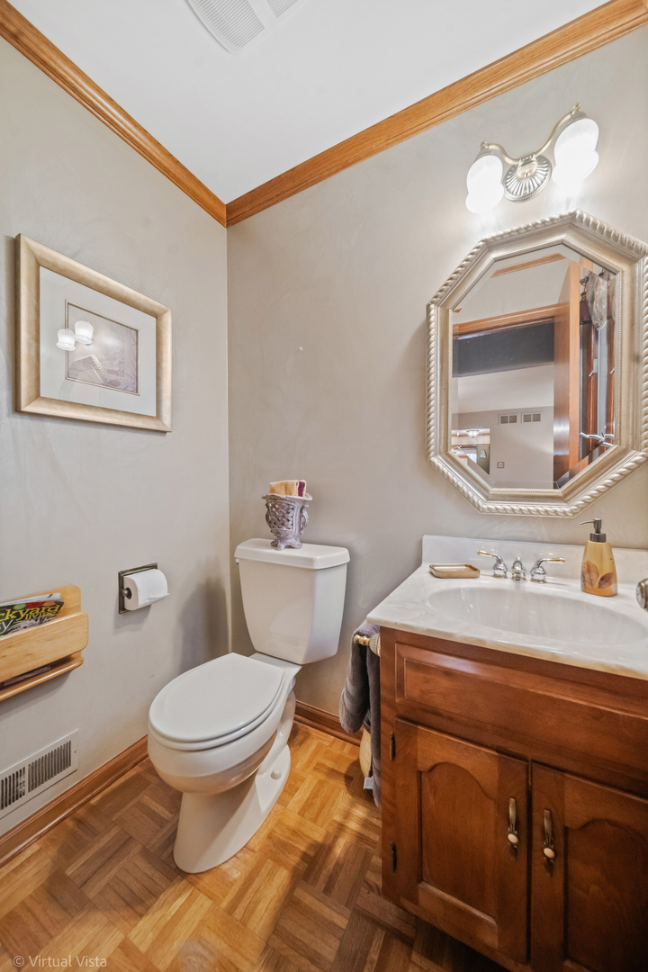 1262 Rutgers Drive Woodridge, IL 60517 - Photo 16 of 22 a bathroom with a sink toilet and mirror