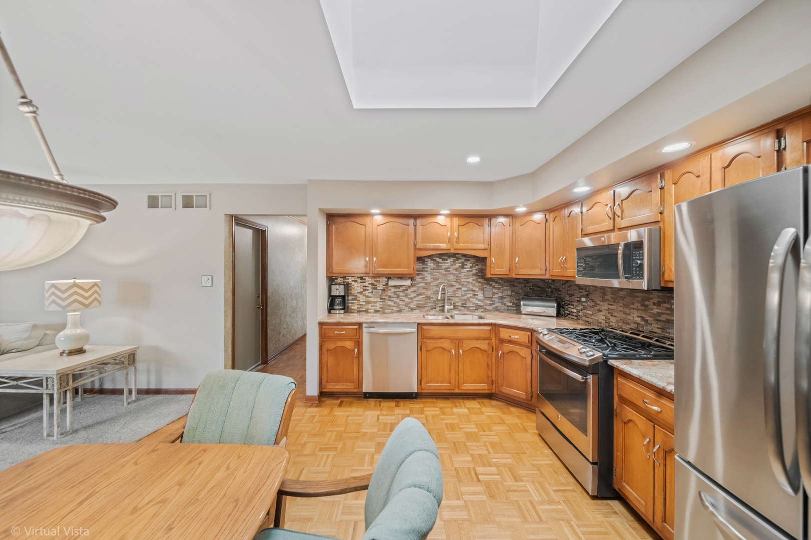 1262 Rutgers Drive Woodridge, IL 60517 - Photo 7 of 22 a kitchen with stainless steel appliances granite countertop a refrigerator a sink a stove and island