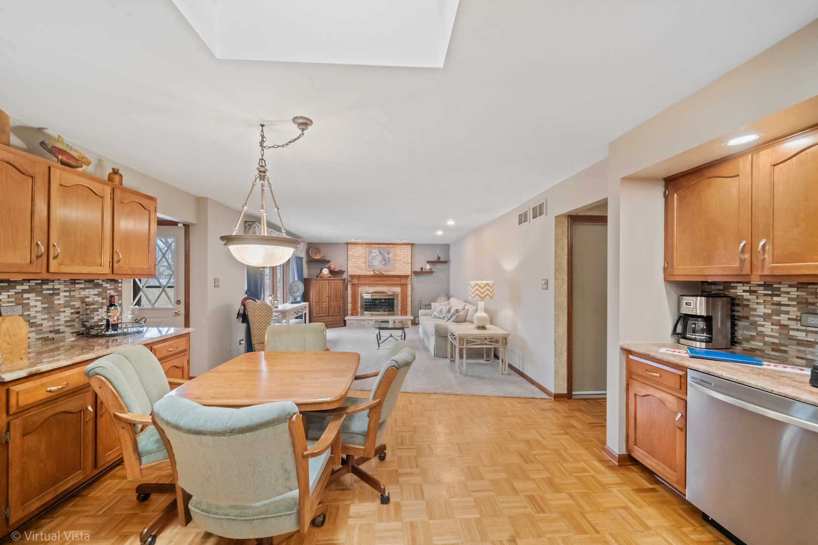1262 Rutgers Drive Woodridge, IL 60517 - Photo 8 of 22 a dining room with furniture a chandelier and wooden floor