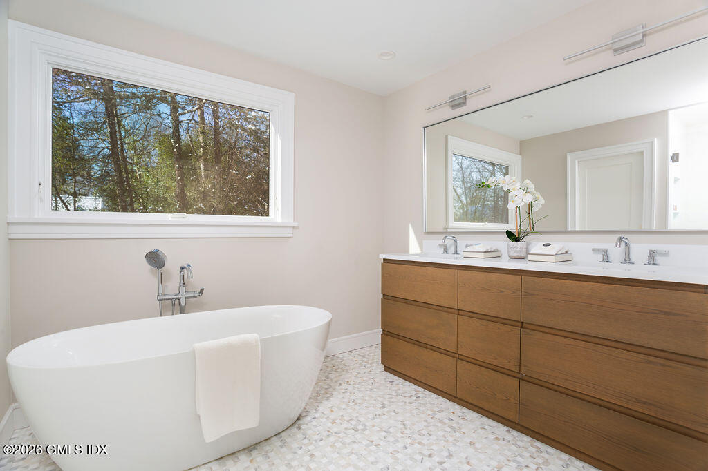 49 Salisbury Road Darien, CT 06820 - Photo 33 of 40 a bathroom with a sink and a bathtub