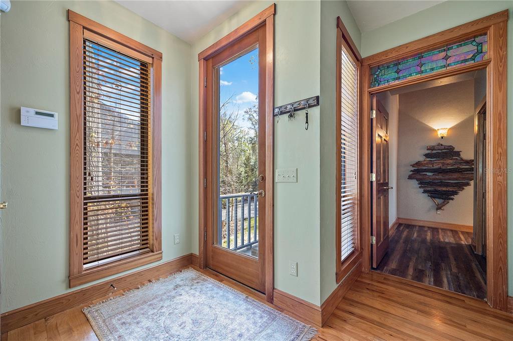 1376 Southwest Riverside Avenue Fort White, FL 32038 - Photo 11 of 40 a view of a hallway with wooden floor and windows
