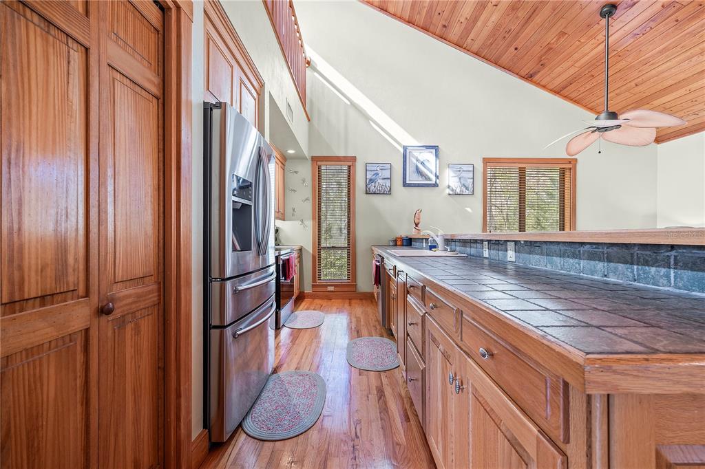 1376 Southwest Riverside Avenue Fort White, FL 32038 - Photo 13 of 40 a spacious bathroom with a granite countertop sink and a mirror