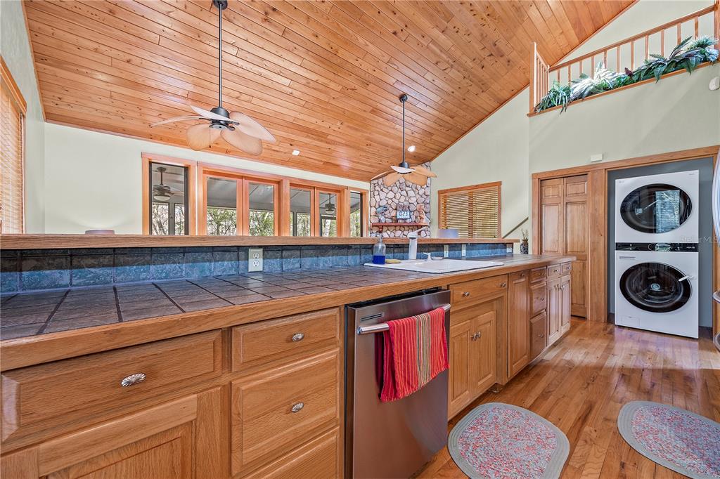 1376 Southwest Riverside Avenue Fort White, FL 32038 - Photo 14 of 40 a kitchen with stainless steel appliances granite countertop a sink and cabinets