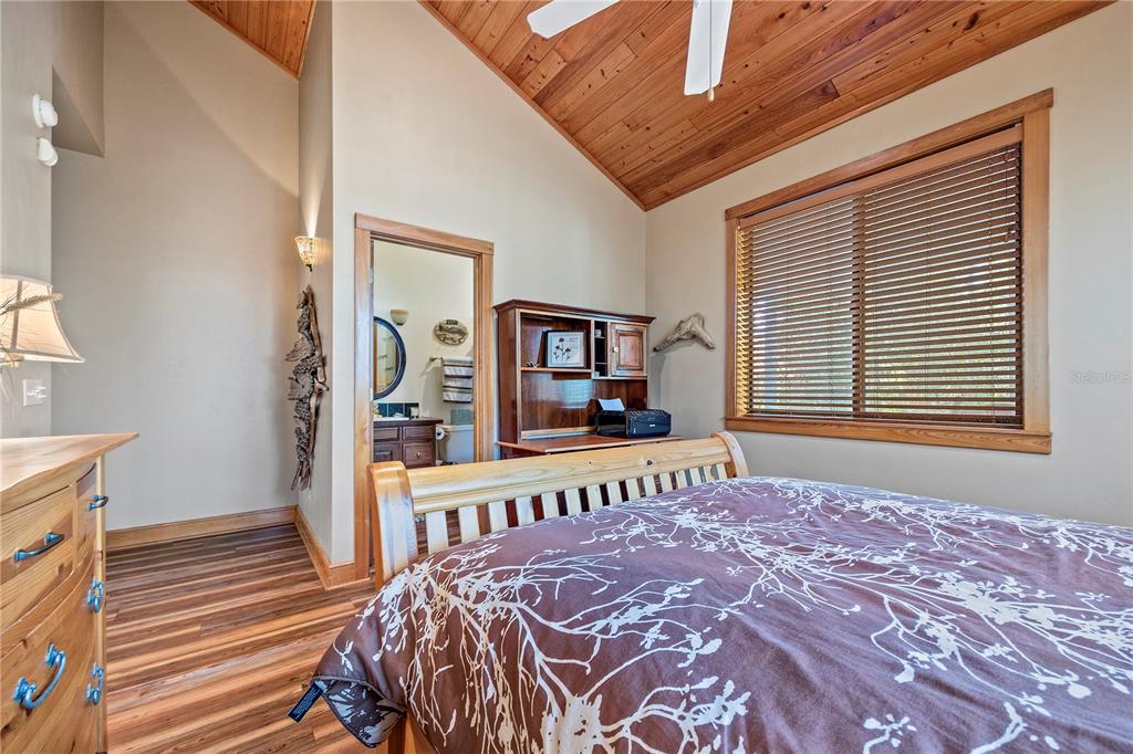 1376 Southwest Riverside Avenue Fort White, FL 32038 - Photo 17 of 40 a bedroom with a large bed and a window