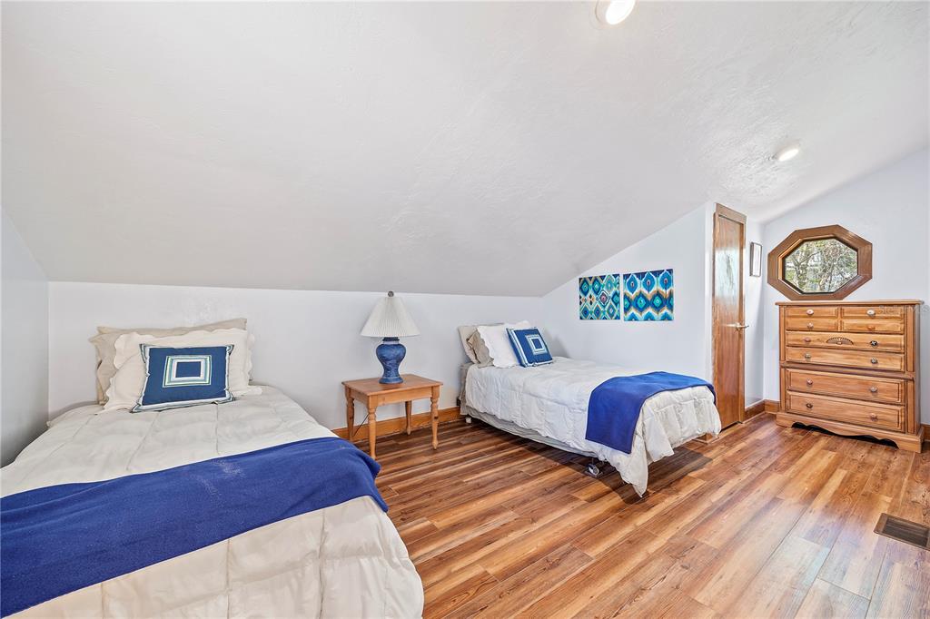 1376 Southwest Riverside Avenue Fort White, FL 32038 - Photo 21 of 40 a bed room with two beds and painting on the wall