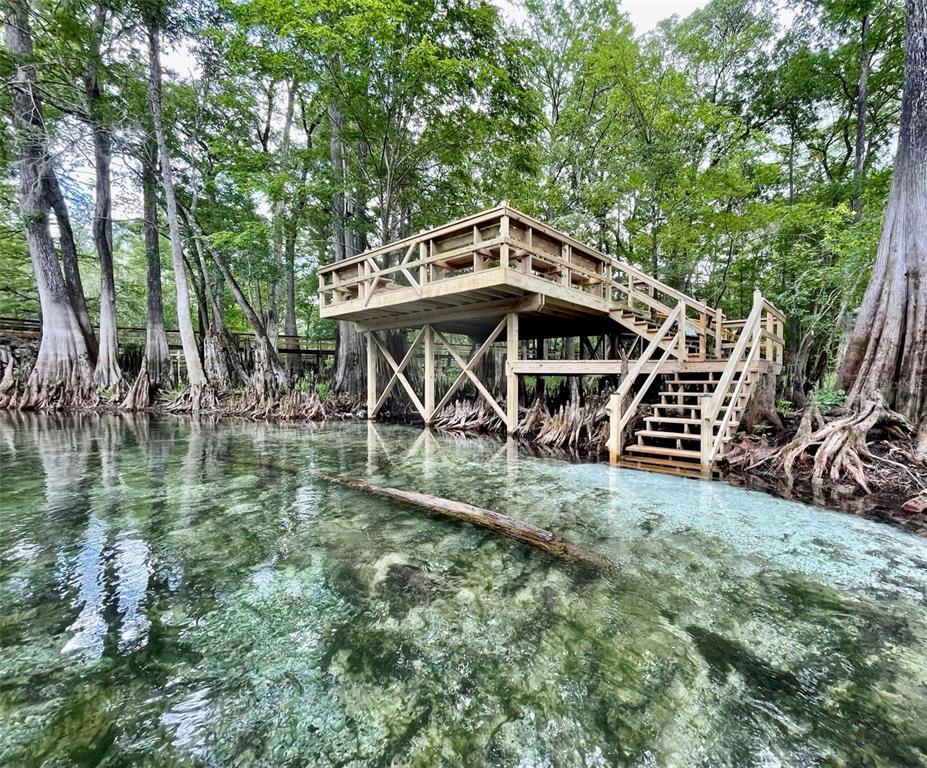 1376 Southwest Riverside Avenue Fort White, FL 32038 - Photo 3 of 40 a view of a wooden deck front of house