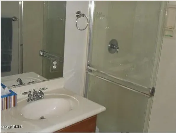 a bathroom with a sink and mirror