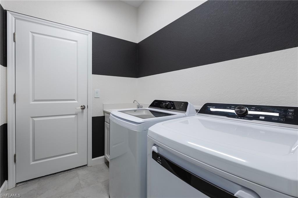 14920 Jadestone Drive Babcock Ranch, FL 33982 - Photo 25 of 25 a utility room with dryer and washer