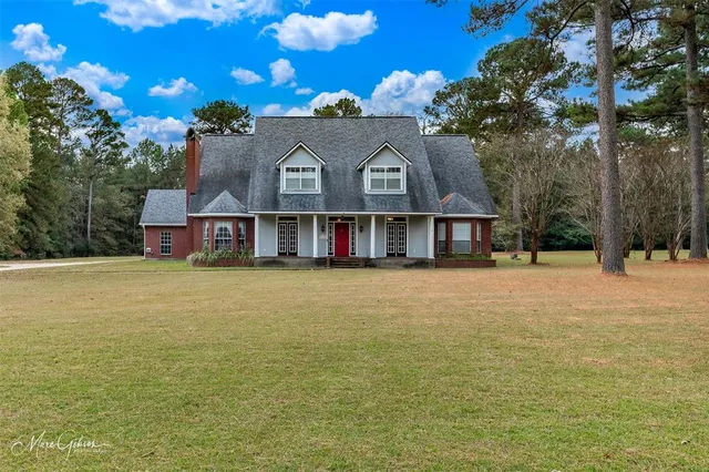 a front view of a house with a ocean view