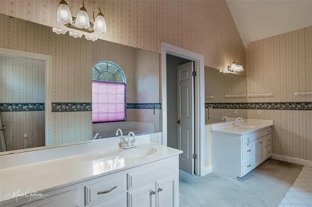 a bathroom with a bathtub and window