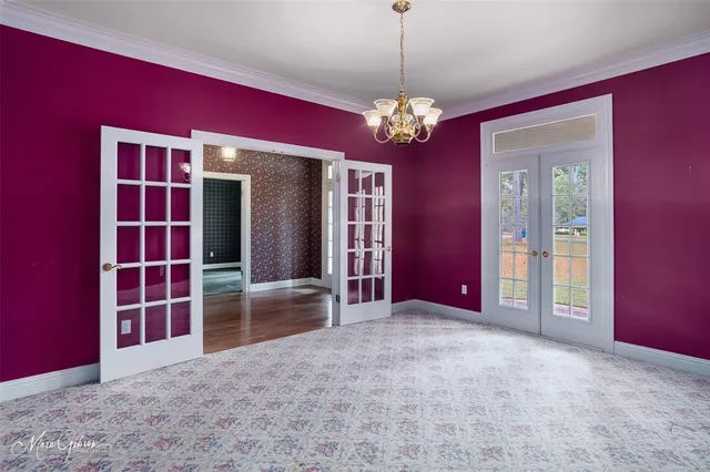 a view of a livingroom with furniture and chandelier