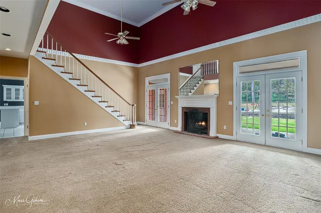 a view of an empty room with a fireplace