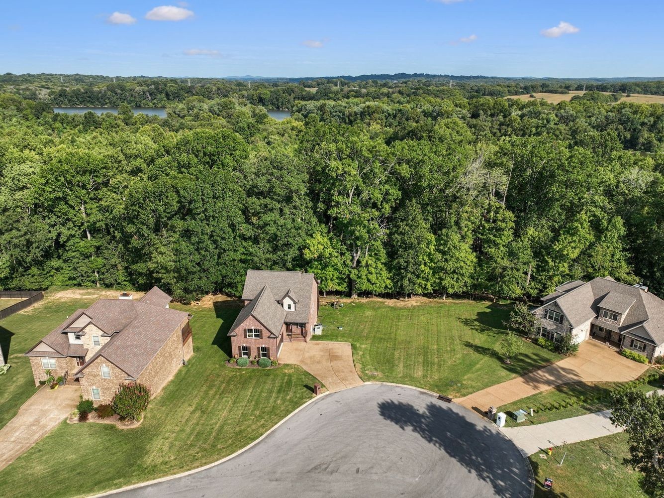 402 Zephyr Cove Lebanon, TN 37087 - Photo 12 of 27 an aerial view of a house with a garden and lake view