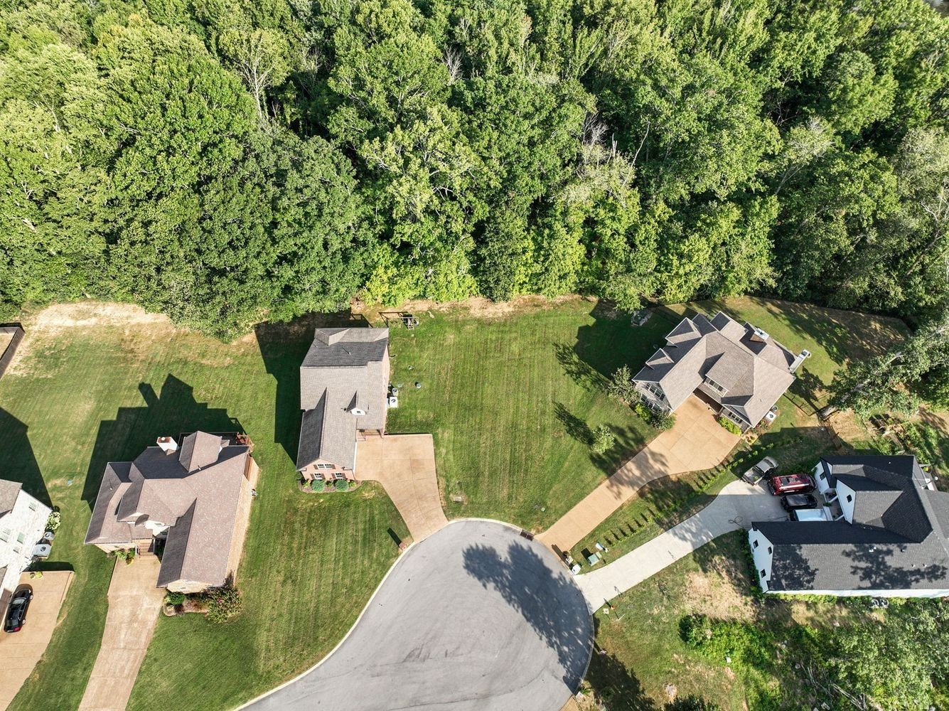 402 Zephyr Cove Lebanon, TN 37087 - Photo 22 of 27 an aerial view of a house with a yard and garden