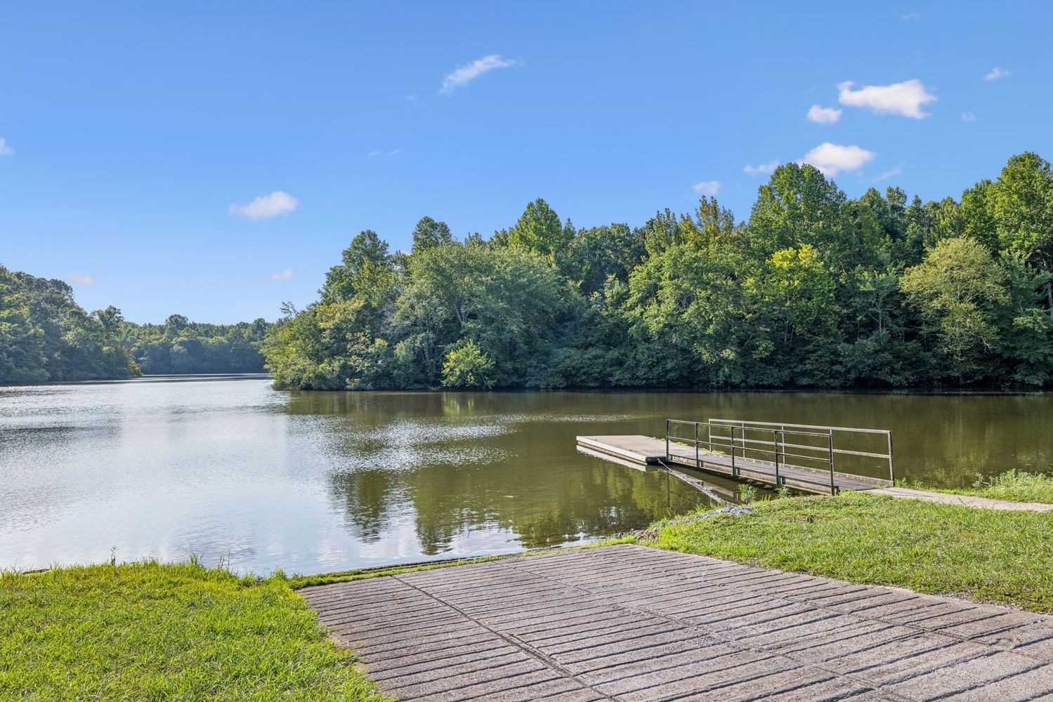 402 Zephyr Cove Lebanon, TN 37087 - Photo 26 of 27 a view of a lake with a yard and a large window