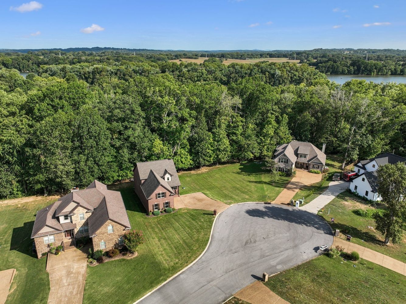 402 Zephyr Cove Lebanon, TN 37087 - Photo 8 of 27 an aerial view of a house with a yard and lake view