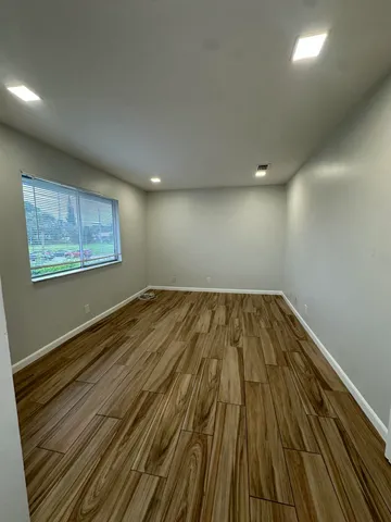 a view of wooden floor in an empty room